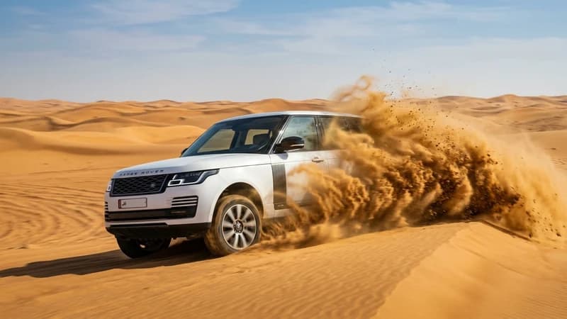 Car driving in sand